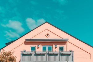 pink and gray house under blue sky